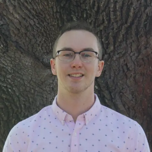 Profile photo of Brennan Valeski in front of an oak tree.